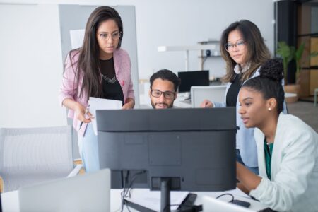 Dust’s Enterprise AI Platform Is Peeling Clients Away from Microsoft Copilot Enterprise team collaborating around screens in a modern office environment