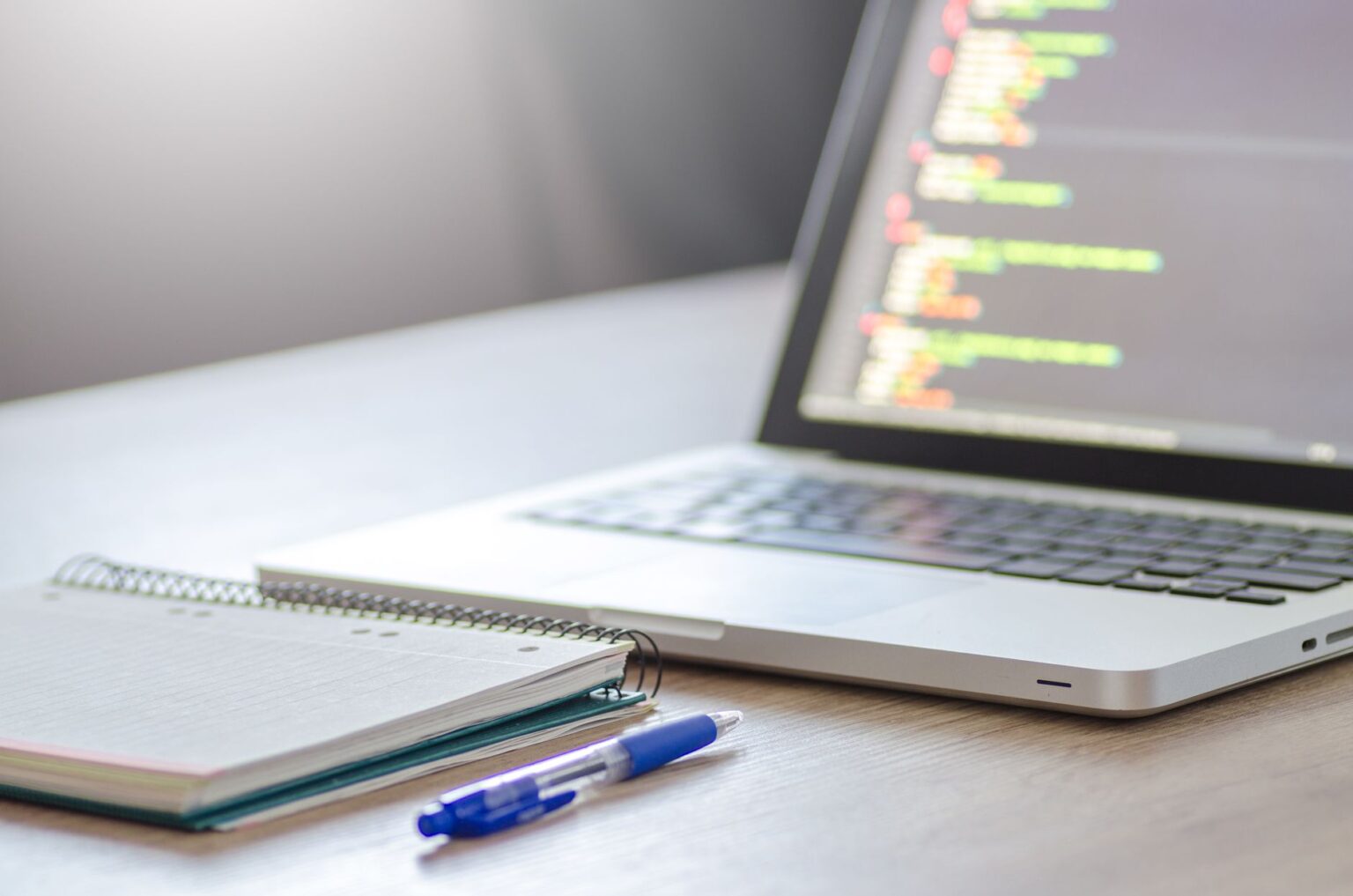 Analyst working on a collaborative data notebook on a laptop screen