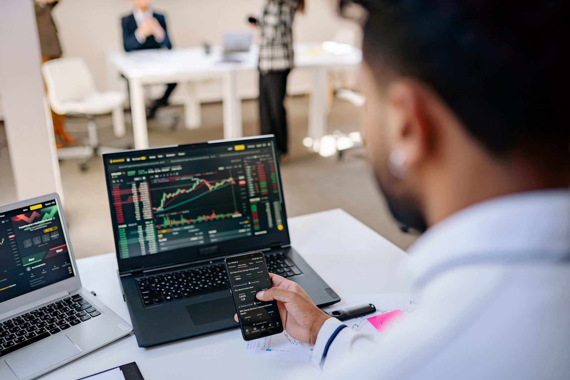 Person reviewing financial dashboard on laptop representing payroll platform comparison