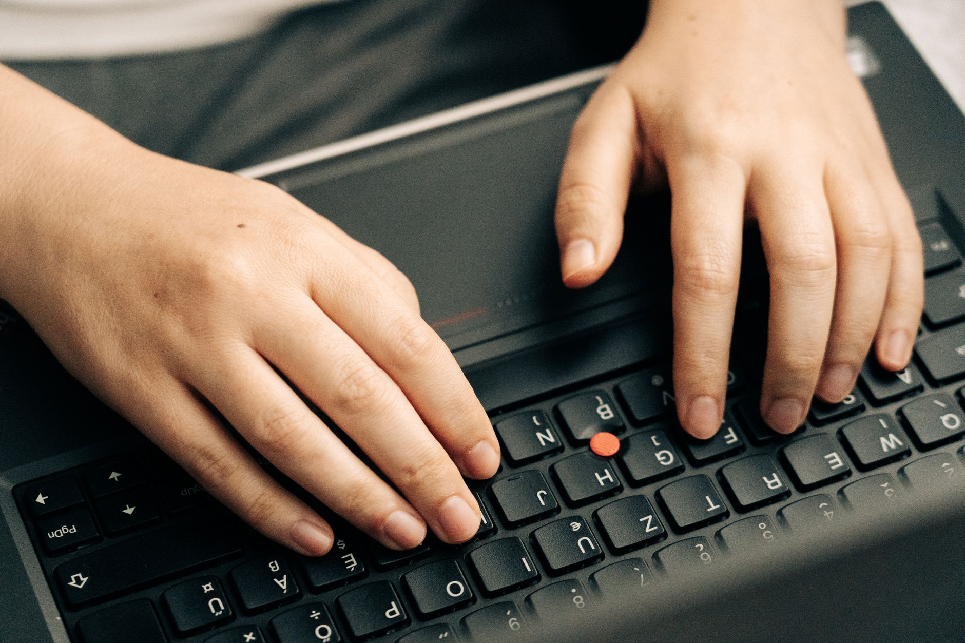 A person working at a laptop, representing productivity software use