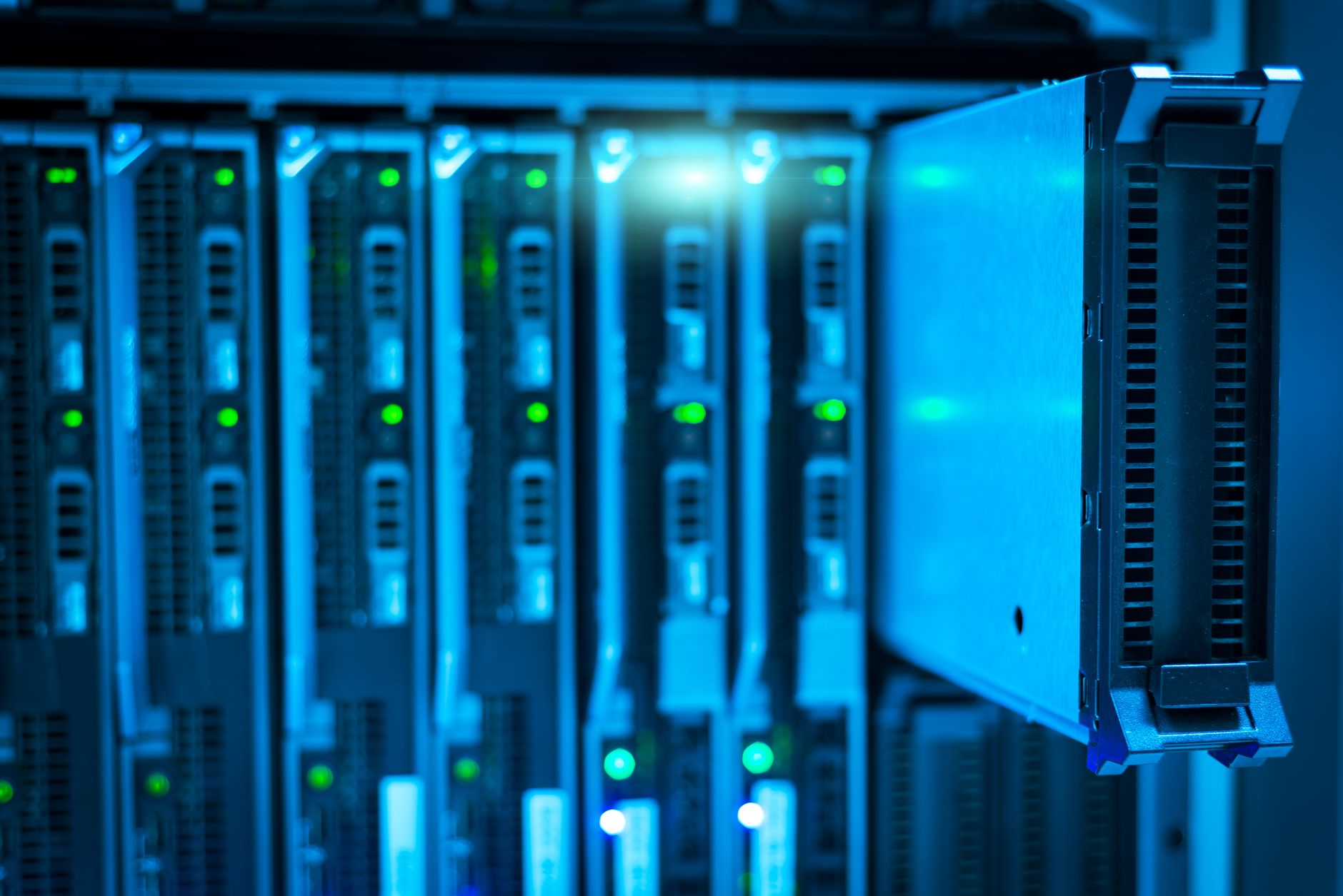 Rows of servers in a modern data center with blue lighting