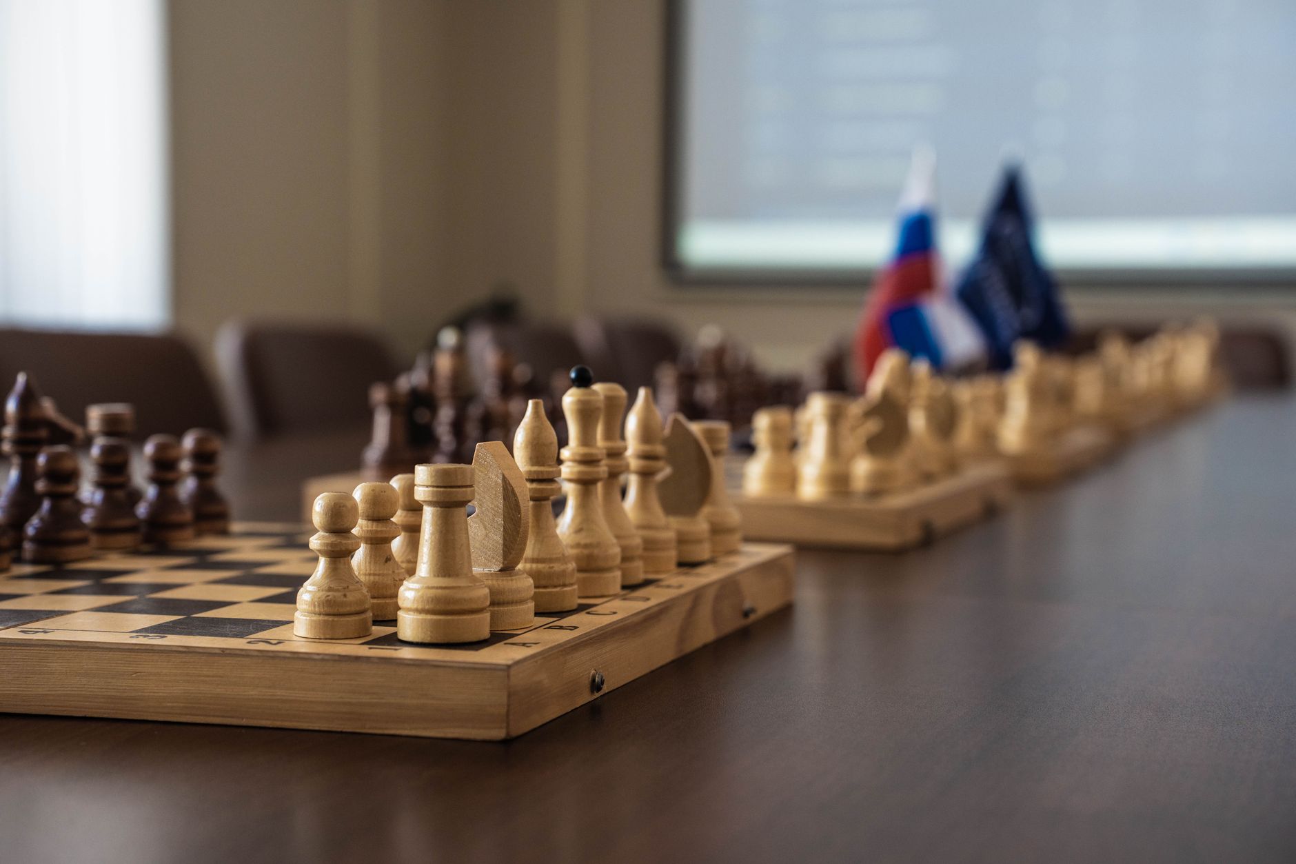 Business professionals in a meeting room discussing competitive strategy