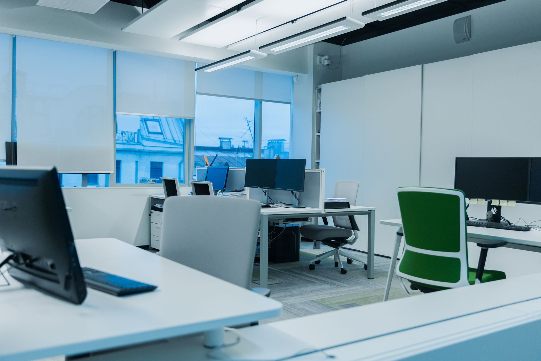Modern fintech company office with employees at workstations