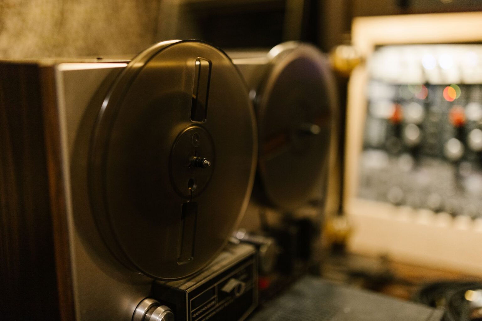 A professional audio recording studio with microphone and soundproofing panels