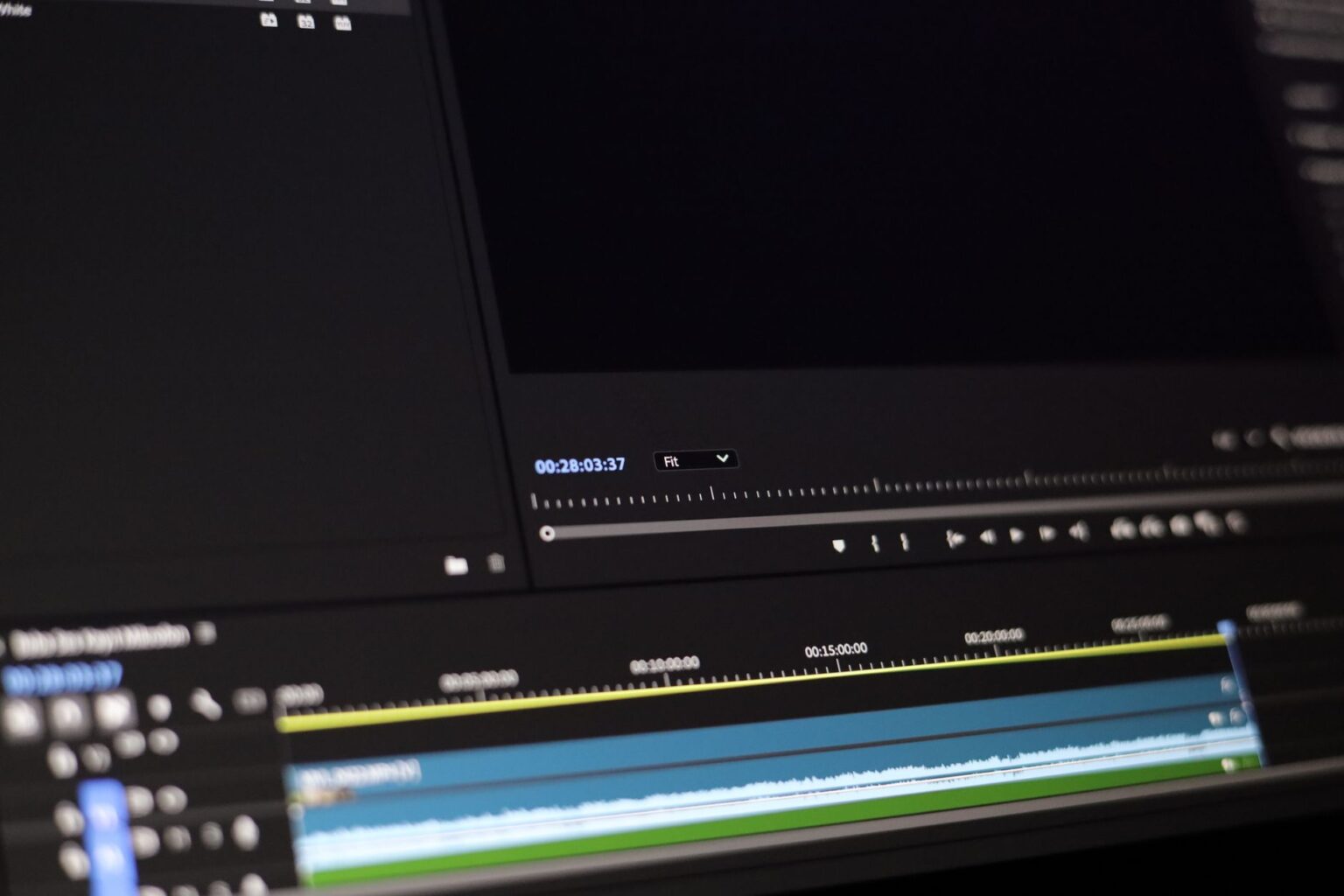 A person editing video content on a desktop computer screen