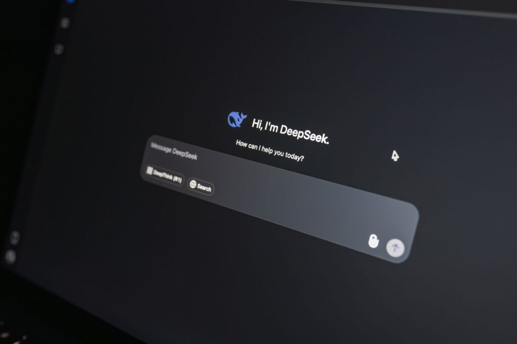 A person using an AI-powered search interface on a laptop screen