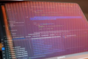 Cursor’s Enterprise Push Is Cornering VS Code’s Dev Workflow Base Developer writing code on a monitor in a modern office environment