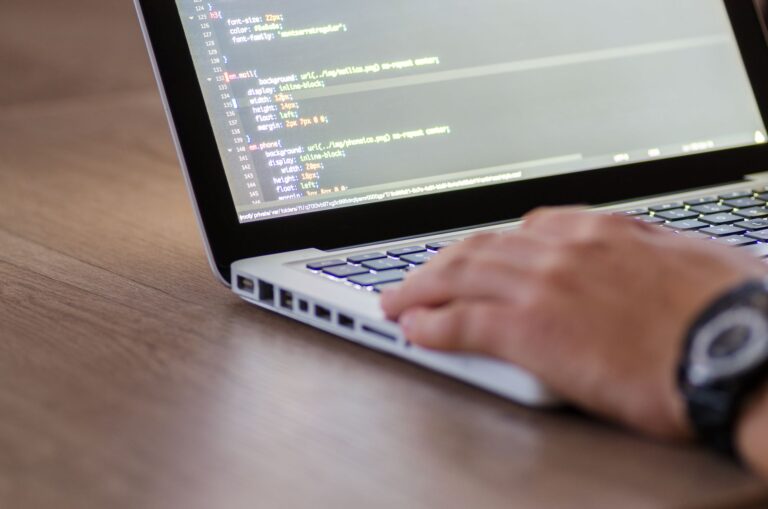 Developer working on a laptop building a web application