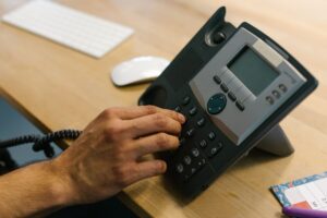 Bland AI’s Voice Agent Platform Is Squeezing Twilio’s CPaaS Base A professional making a phone call in a modern office environment