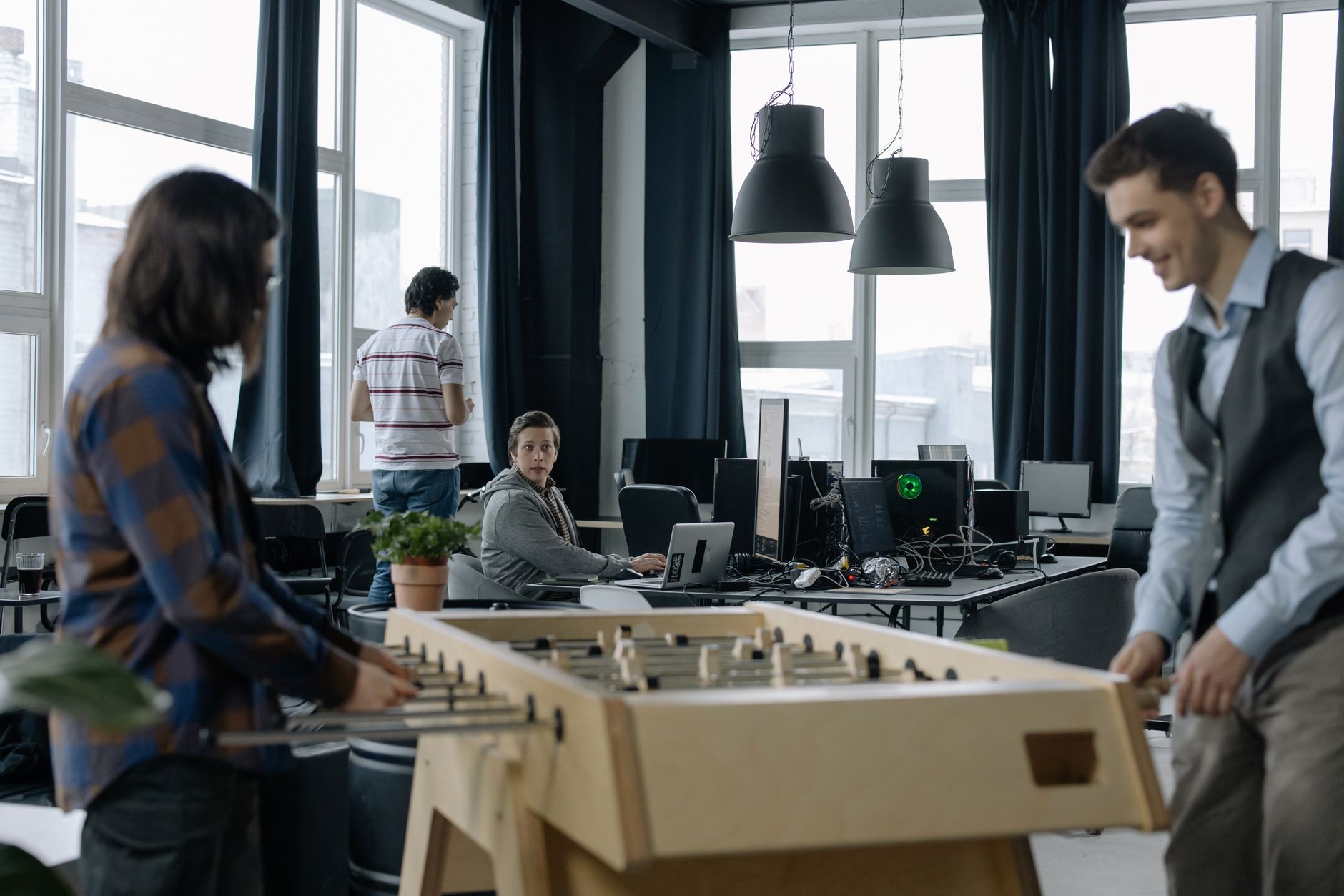 Modern startup workspace with computers and collaborative work environment