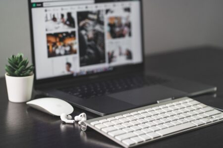 Notion’s Database Limits Are Pushing Power Users Toward Coda A clean modern desk workspace with laptop and notebook representing digital productivity tools