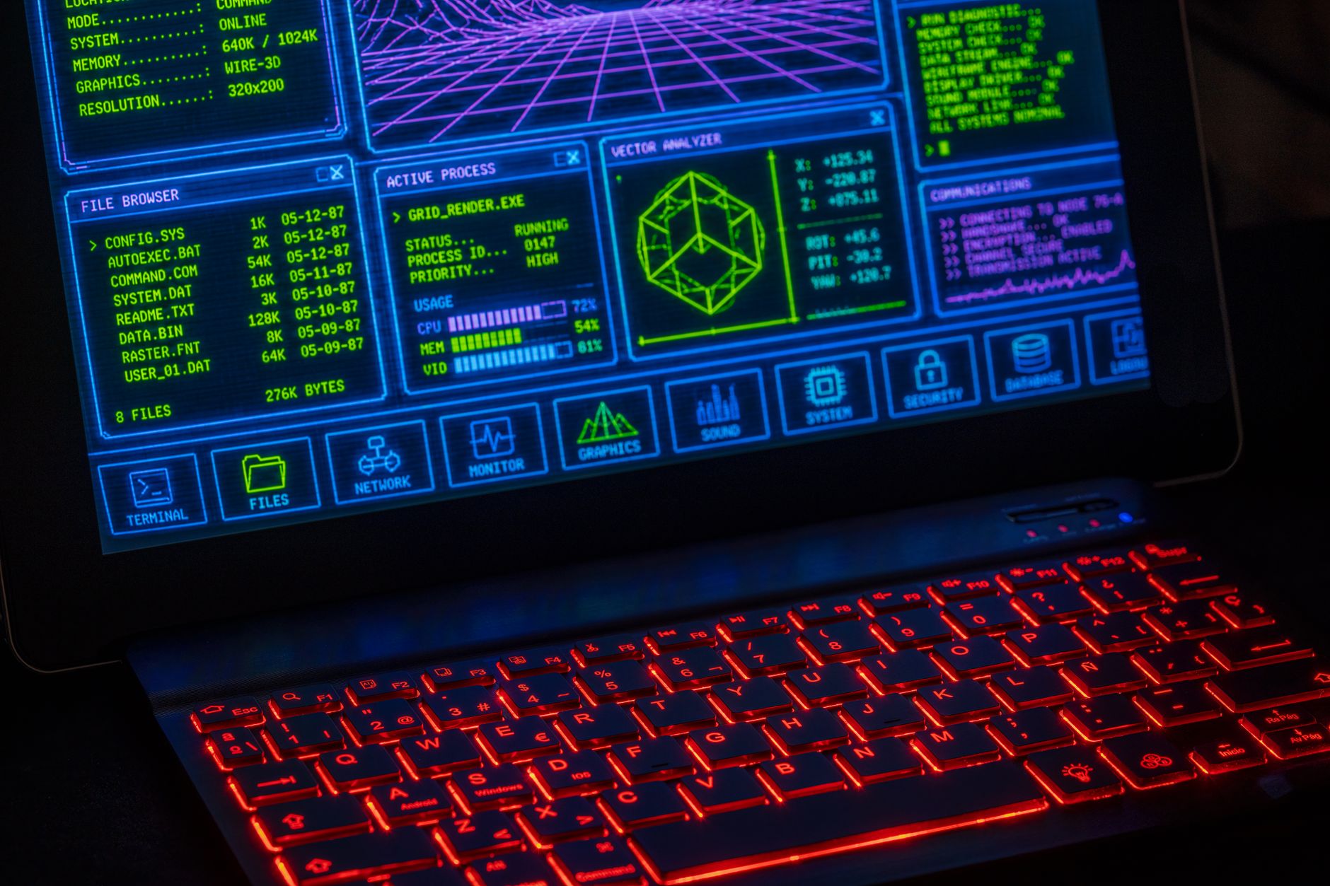 A person working on a laptop screen displaying data tables and software interface