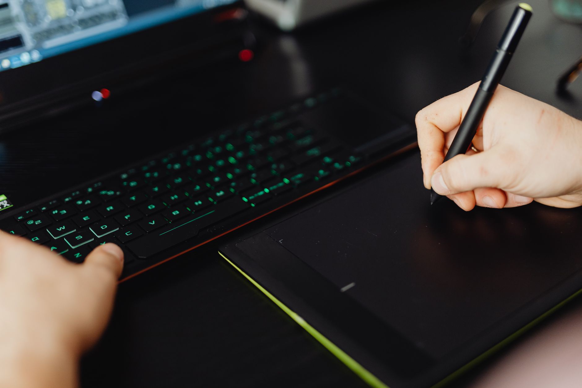 Person writing notes on a digital tablet with stylus