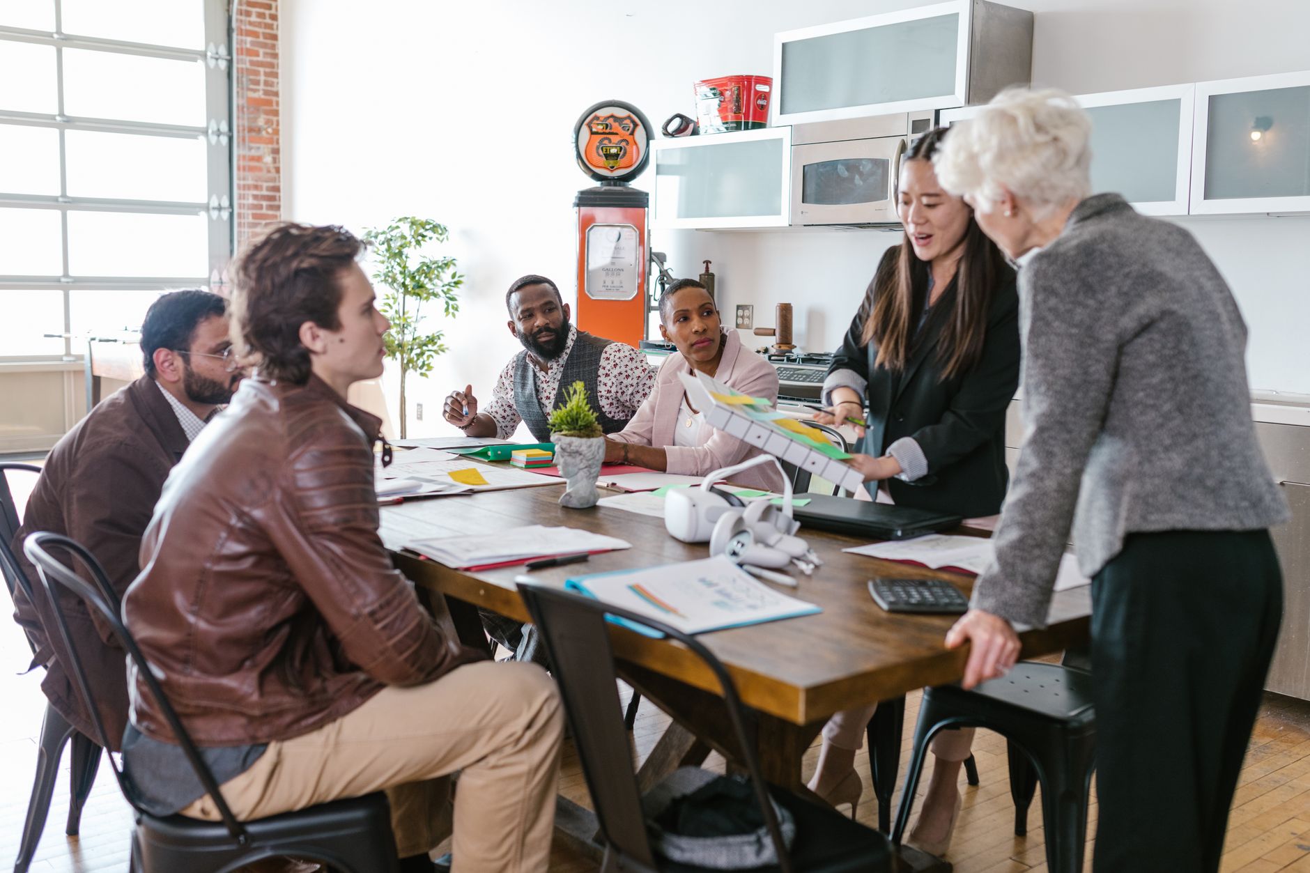 Modern fintech startup office with employees at computers